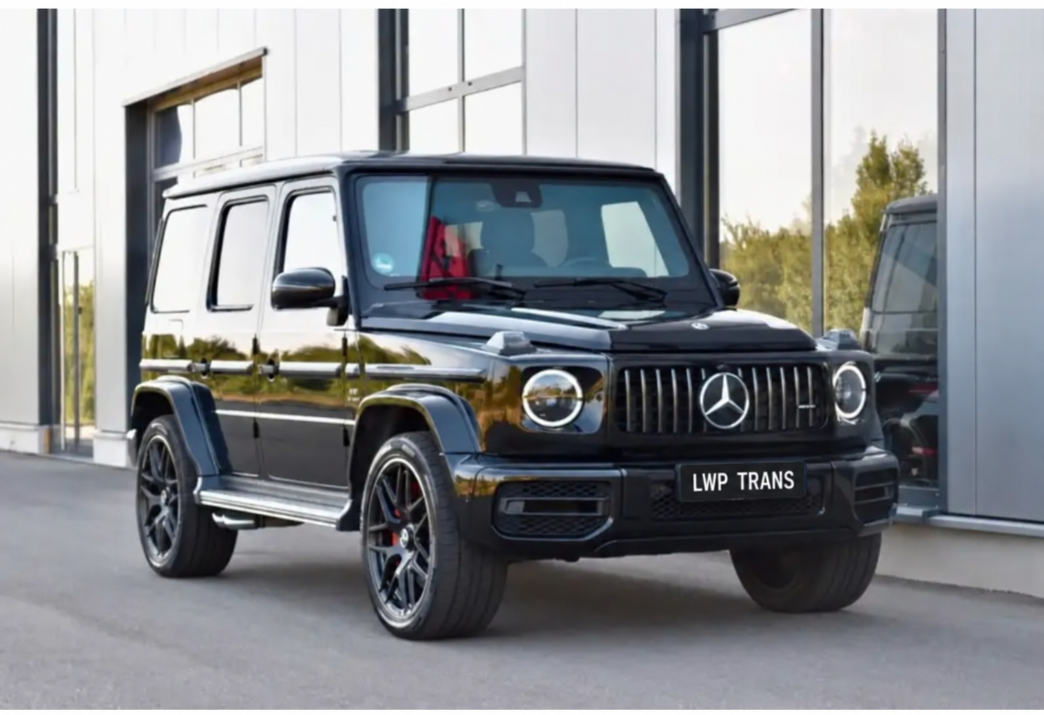 Black Mercedes-Benz G-Class outside a showroom