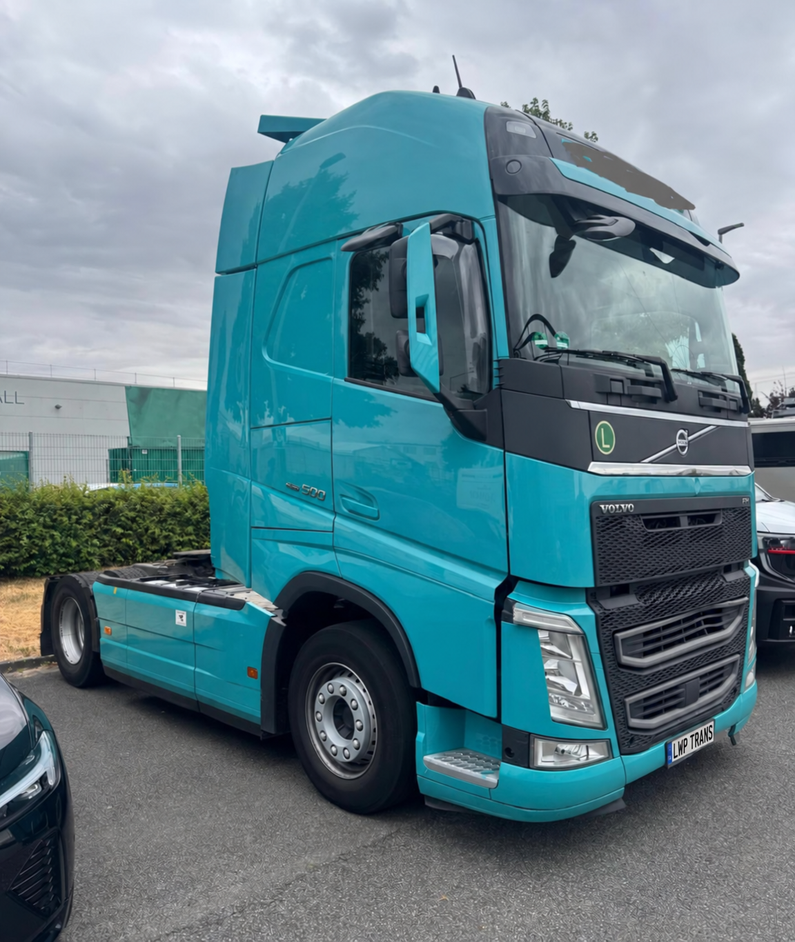 Turquoise Volvo FH 500 tractor unit